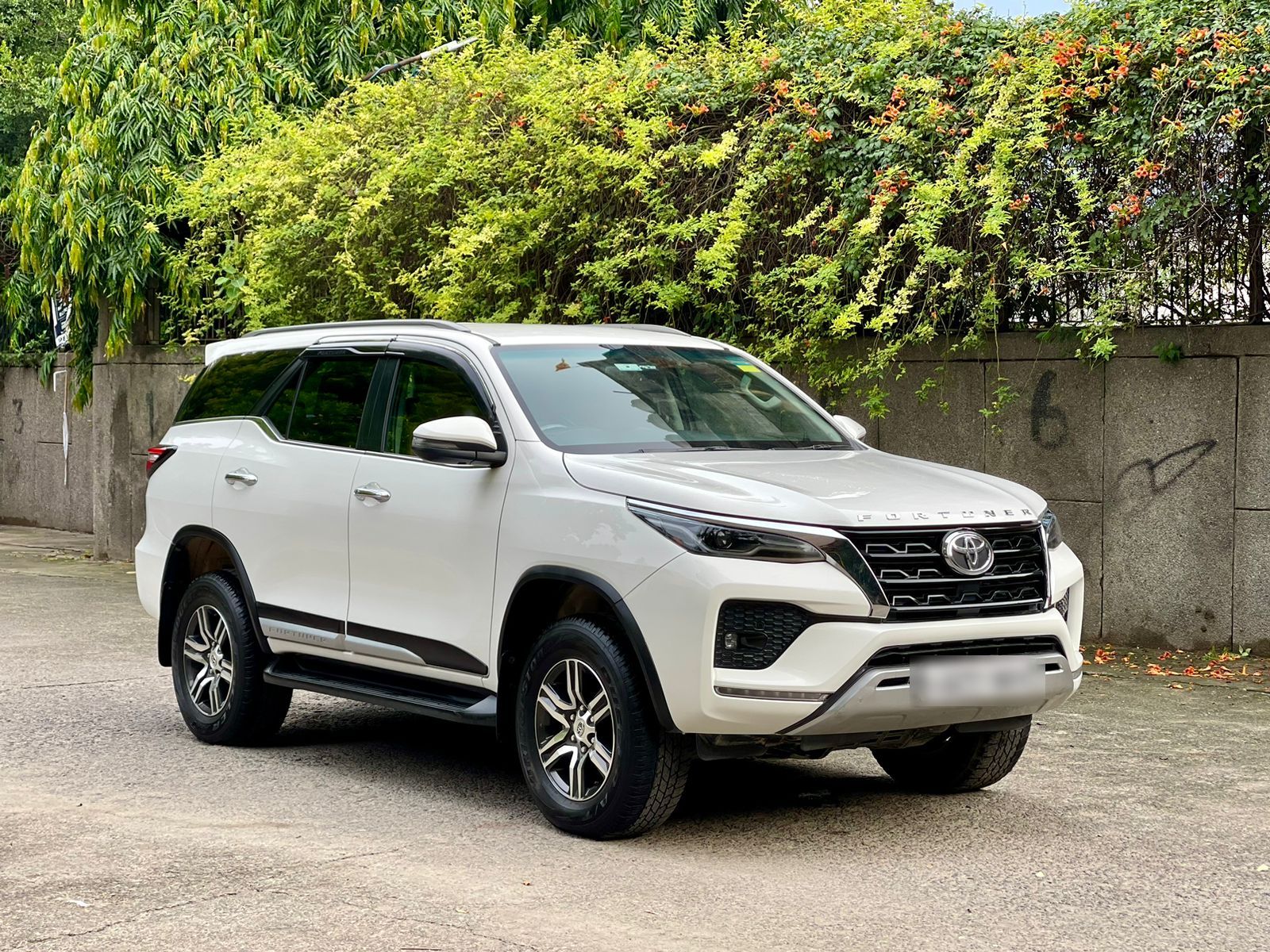 White Toyota Fortuner available for car rental in Chennai with driver