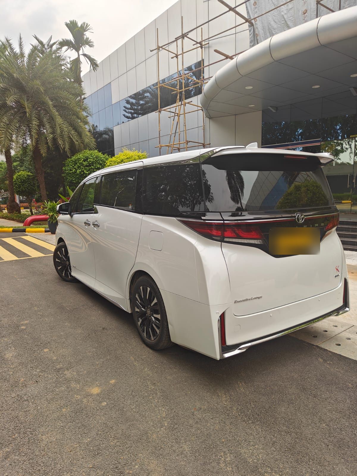 Pearl white Toyota Vellfire side profile
